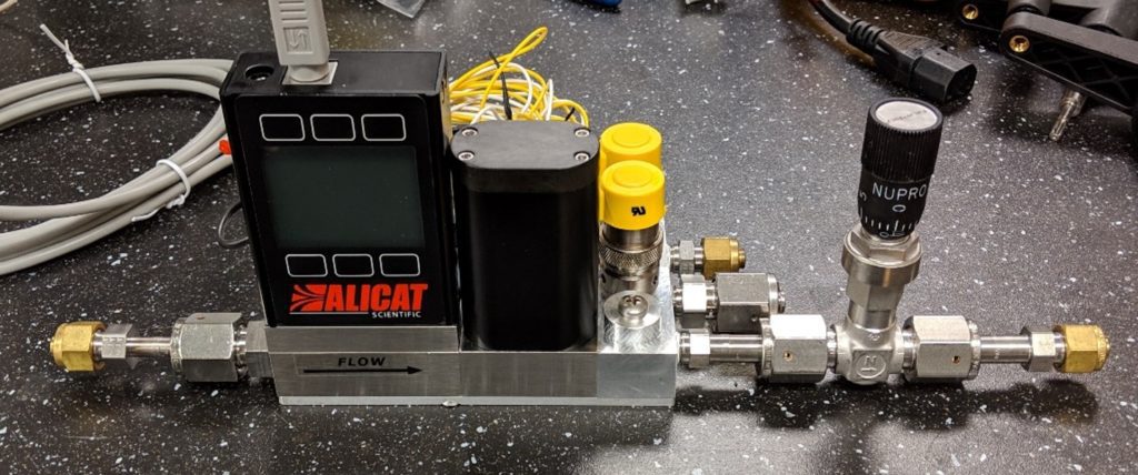 Alicat IVC-Series pressure controller with additional manifold for substrate heat transfer